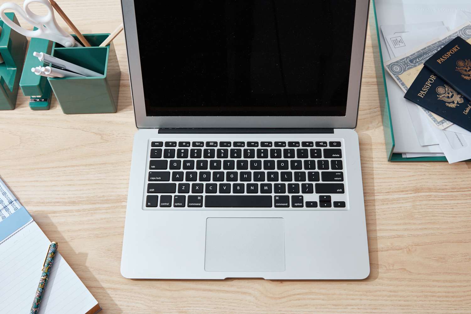 A table with documents such as social security cards, driver's license, tax records, and bank statements.